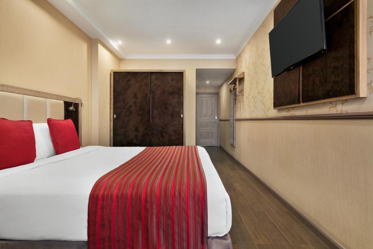 Hotel Ramada By Wyndham Bishkek Centre Extérieur photo